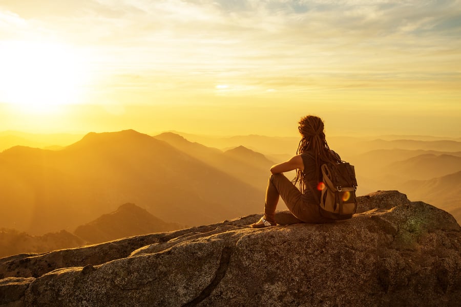 Hiker meets the sunset on the Moro rock in Sequoia national park, California, USA.